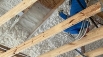 Image of ENERTITE X BASF Open-cell- SPray Polyurethane Foam installed in an overhead cavity