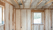 Image of house under construction with BASF Open-cell Spray Polyurethane Foam installed in the wall cavitites and ceiling Image of house under construction with BASF Open-cell Spray Polyurethane Foam installed in the wall cavitites and ceiling