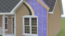 Exterior cutaway of a wall to reveal WALLTITE purple spray foam installed to the interior wall cavity. Exterior cutaway of a wall to reveal WALLTITE purple spray foam installed to the interior wall cavity.