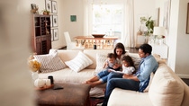 Family sitting in living room