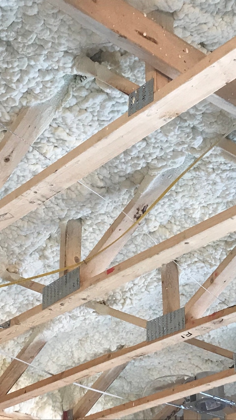 Image of Open-cell Spray Polyurethane Foam installed in overhead cavity Image of Open-cell Spray Polyurethane Foam installed in overhead cavity
