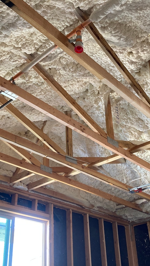 Image of an overhead ceiling cavity with BASF Open-cell SPray Polyurethane Foam installed