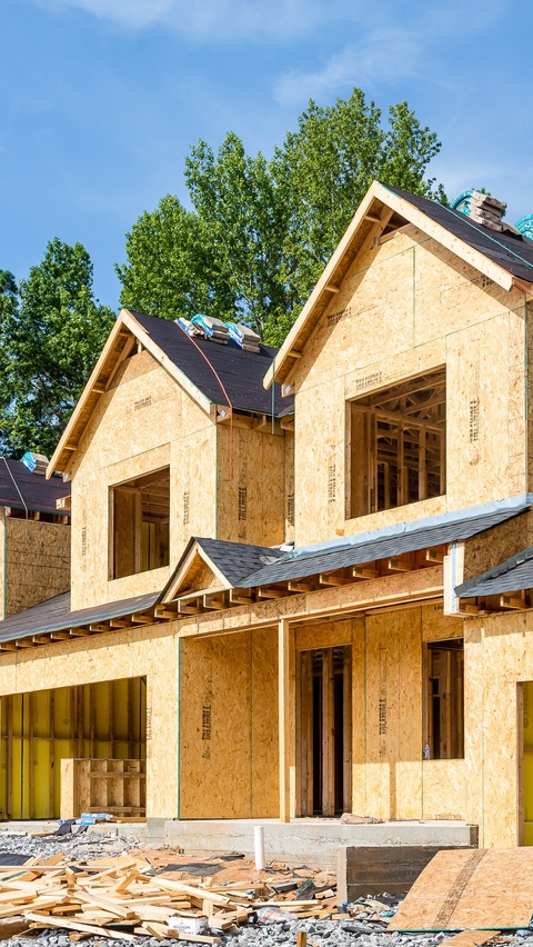 Image of several residential buildings under construction