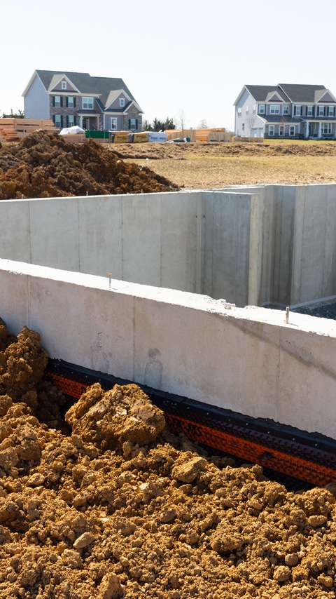 Image of the cement foundation of a residential building