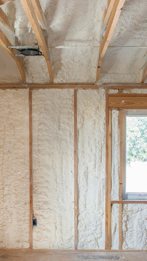 Image of house under construction with BASF Open-cell Spray Polyurethane Foam installed in the wall cavitites and ceiling Image of house under construction with BASF Open-cell Spray Polyurethane Foam installed in the wall cavitites and ceiling